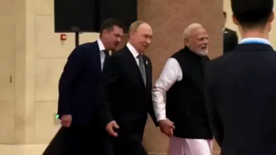 Putin and Modi Walk Hand-in-Hand to Meet Xi.