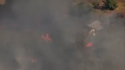 A Fast Moving Brushfire Destroys Homes in Lakeside, California. 