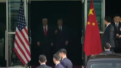 President Trump shakes hands with China's President Xi after their historic meeting in South Korea.