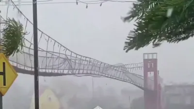 Powerful Winds from Fung-wong Shake Suspension Bridge in the Philippines.