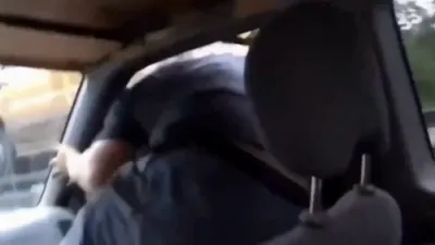 Man Leaps Onto Moving Tow Truck to Rescue Towed SUV.