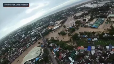 Typhoon Tino Submerges Philippines Neighborhoods as Floodwaters Reach Rooftops.