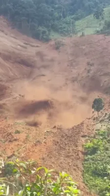 A Massive Landslide Buries Homes in Vietnam; Three Workers Are Feared Trapped Under Debris.