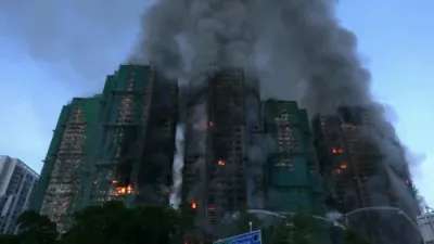 Hong Kong Apartment Fire Leaves Multiple Dead, Firefighters Battling Flames.