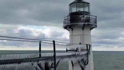 Winter Storm Freezes Lake Michigan Pier in Striking Icicle Display.