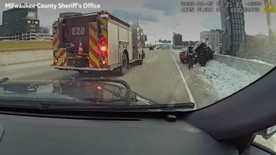 Bodycam Captures Dramatic Rescue of FBI Agent From Suspended Vehicle.