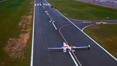 Nine Cyclists Make History by Pulling Aircraft Into the Sky.