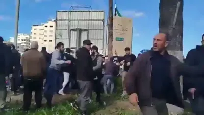Armed Men Confront Alawite Protesters in Syria as Gunfire Rings Out.