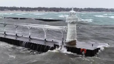 Frozen Lighthouse Engulfed by Monster Waves in Lake Michigan Storm.