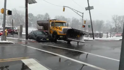 Snowplow Collides With Car During Winter Storm in New Jersey.