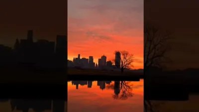 CALM BEFORE THE STORM: Orange Sunrise Over Dallas Signals Incoming Winter Storm.