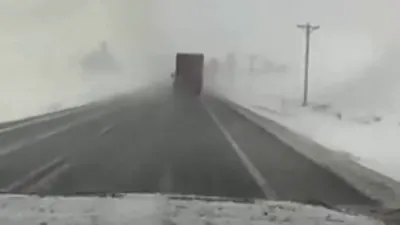 Iowa Dashcam Captures Truck Sliding on Slick Roadway.