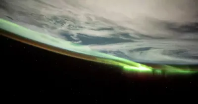 FROM SPACE: Green Auroras Light Up Earth in Rare Space View.