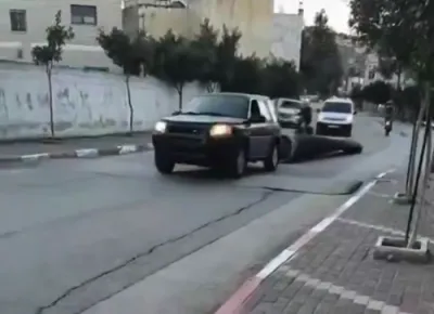 Missile Debris Towed Through West Bank by a Palestinian After Interception