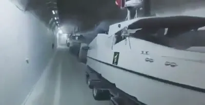 Iran Unveils Underground Naval Tunnel for Missile Boats.