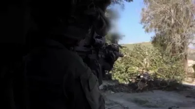 Israel raids Hezbollah positions, captures weapons, escalating conflict on border.