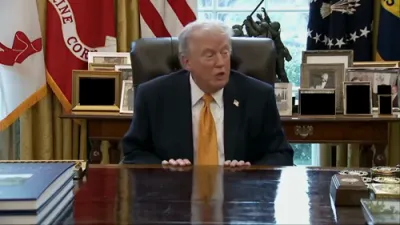 Trump Playfully Hugs B-2 Bomber in Oval Office Address.
