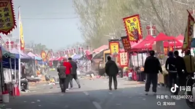 Vehicle Charges Through China Market in Apparent Revenge Attack.
