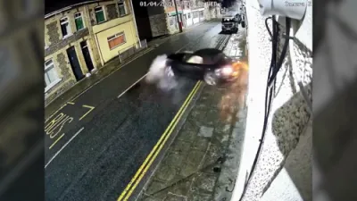 CCTV Captures BMW Smash Into Home, Suspect Flees