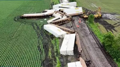 Drone Footage Reveals Devastating Train Derailment in Western Illinois Farmlands Post-Storms.