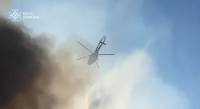 Devastating Russian Assault: Helicopters Rush to Extinguish Kyiv Fires After Missile Onslaught.