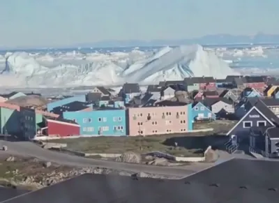 Watch: Massive Iceberg Suddenly Capsizes Off Greenland's Icy Coastline.