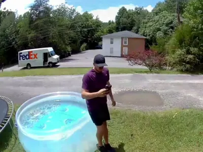 😆 Doorbell Cam Catches FedEx Driver's Epic Pool Splashdown &mdash; His Reaction Says It All.