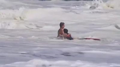 Waves Kept Knocking Him Down, But Teen Lifeguard Refused to Let Go.