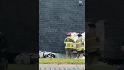 Firefighters Cut Into Toppled House to Free Trapped Driver.