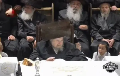 The Belzer Rebbe Shlit"a in deveikus after the bris of a grandchild