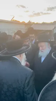 The Toldos Aharon Rebbe Shlit"a wishing Hagaon Hechasid R' Yosef Chaim Greenwald Shlit"a "gepoilt alles guts" after the Hisorerus Rachamim gathering at the tziyon in Liska