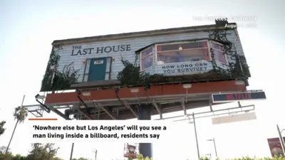 This Man Is Living on a Billboard Above LA to Hype Netflix's Newest Thriller Movie.