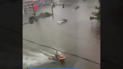 Once-in-a-Lifetime Chance: Norfolk Man Jet Skis Through Flooded Streets.