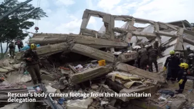 RACE AGAINST TIME: Israeli Rescuers Hunt Missing in Colombia's Collapsed Buildings.