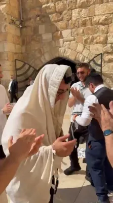 Binyamin Chasin at the Kosel Upon Arriving in Yerushalayim, After Being Freed From Iraqi Prison Following 11 Years of Languishing in Captivity
