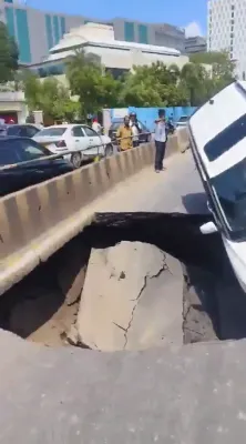 TEN-FOOT TERROR: Sinkhole Flips Car Upside Down On Busy Road