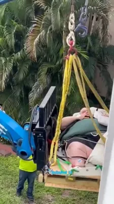 DRAMATIC CRANE RESCUE: Florida Firefighters Extract 600-Pound Man From Second-Floor Apartment