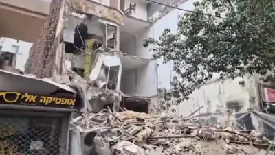 Emergency Responders on the Scene of a Partially Collapsed Three-Story Building in Tel Aviv, Israel