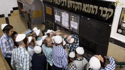 Talmidim of Talmud Torah Toldos Aharon Davening at the Tziyon of Rabbi Meir Baal HaNes