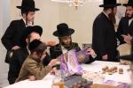 מעמד חתימת שטרות בבית הרבני הגניד רבי הערשל פישמאן הי"ו לרגל קניית זכות בית התבשיל בבנין החדש במחנה אהל ברוך "רבי יוסל'ס קאך" בראשות הגה"צ אב"ד ור"מ קראסנא שליט"א