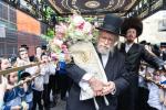 חגיגת הכנסת ספר תורה  להיכל ישיבת עסק התורה  ע"י הרבני הנגיד הרה"ח רבי יואל פליישמאן שליט"א פטרון הישיבה ונדבן הספר  בהשתתפות אדמור"י ורבני העיר שליט"א, מרביצי תורה ותלמידי הישיבה