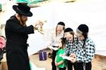 בילדער: כפרות שלאגן אין בני ברק ערב יום כיפור