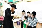 בילדער: כפרות שלאגן אין בני ברק ערב יום כיפור
