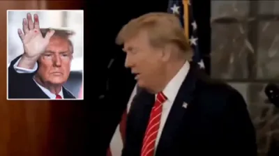 פרעזידענט טראמפ זאגט אז די בילד וואס איז פארשפרייט געווארן פון אים מיט רויט געפארבטע הענט איז פאלטש 