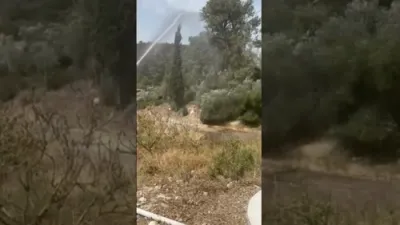 מען ארבעט שווער צו פארלעשן די פייערן ארום ירושלים 