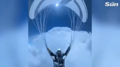 א פעראשוט לאנדער לעבט מיט שווערע וואלקענעס ביים לאנדן