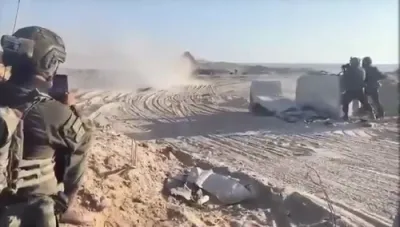 איינוואוינער אין עזה נעמען אויף די IDF מיט פרייד 