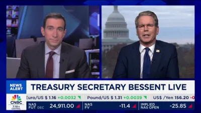 סעקרעטאר בעסענט רופט מאמדאני די פירער פון דעמאקראטישער פארטיי.