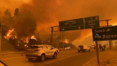מאסן הייזער עוועקואירט אין טשילע צוליב די וואלד פייער 