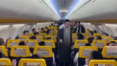 הרב אייזנבערג מאכט א קומזיץ אויפן פליגער